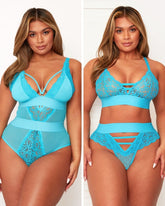 Woman wearing a blue lace lingerie set on a plain background