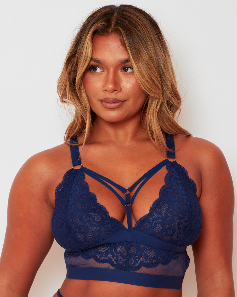 Close-up front view of the Brooke Fuller Bust Bralette in Oceanic Blue featuring floral lace cups, decorative strappy neckline, sheer mesh underband and gold-tone hardware.