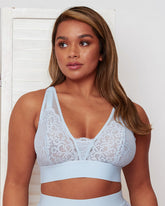 Front view of the Hallie Bralette in Ballad Blue by Tutti Rouge, featuring soft floral lace, sheer mesh panels, a deep V-neckline, and wide supportive bands for a comfortable, feminine fit.