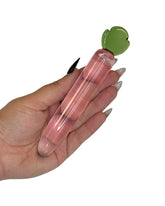Glass Toy from Brand X by Tutti, in the same of a long raddish in a hand for size context