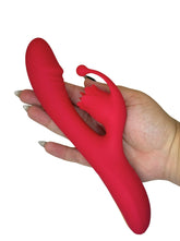 Red silicone Personal Toy held by a hand on a white background