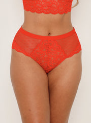 Red lace lingerie set on a plain background
