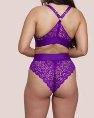 Purple lace lingerie set on a plain background