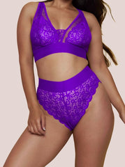 Purple lace lingerie set on a beige background