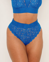 Blue lace lingerie set on a plain background