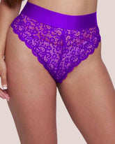 Purple lace underwear on a neutral background