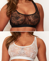 Two lace bras, one black and one white, worn by a model on a plain background.