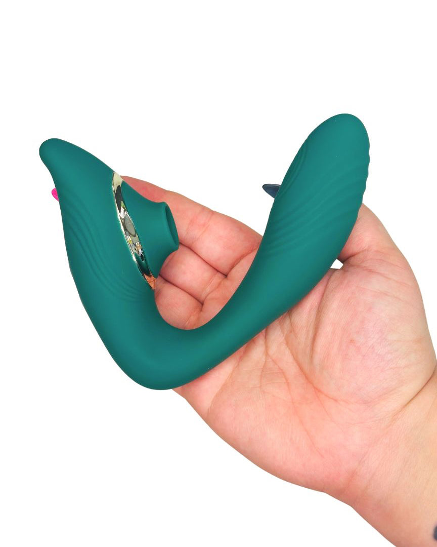 Teal hand personal massager adult toy in a hand on a white background