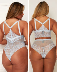 Lace lingerie set worn by a model on a plain background