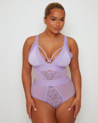 Three-quarter front view of the Alicia Fuller Bust Curvy Girl Bodysuit in Soft Lavender, highlighting the sculpting fit, soft mesh construction, lace inserts, and elegant neckline straps.