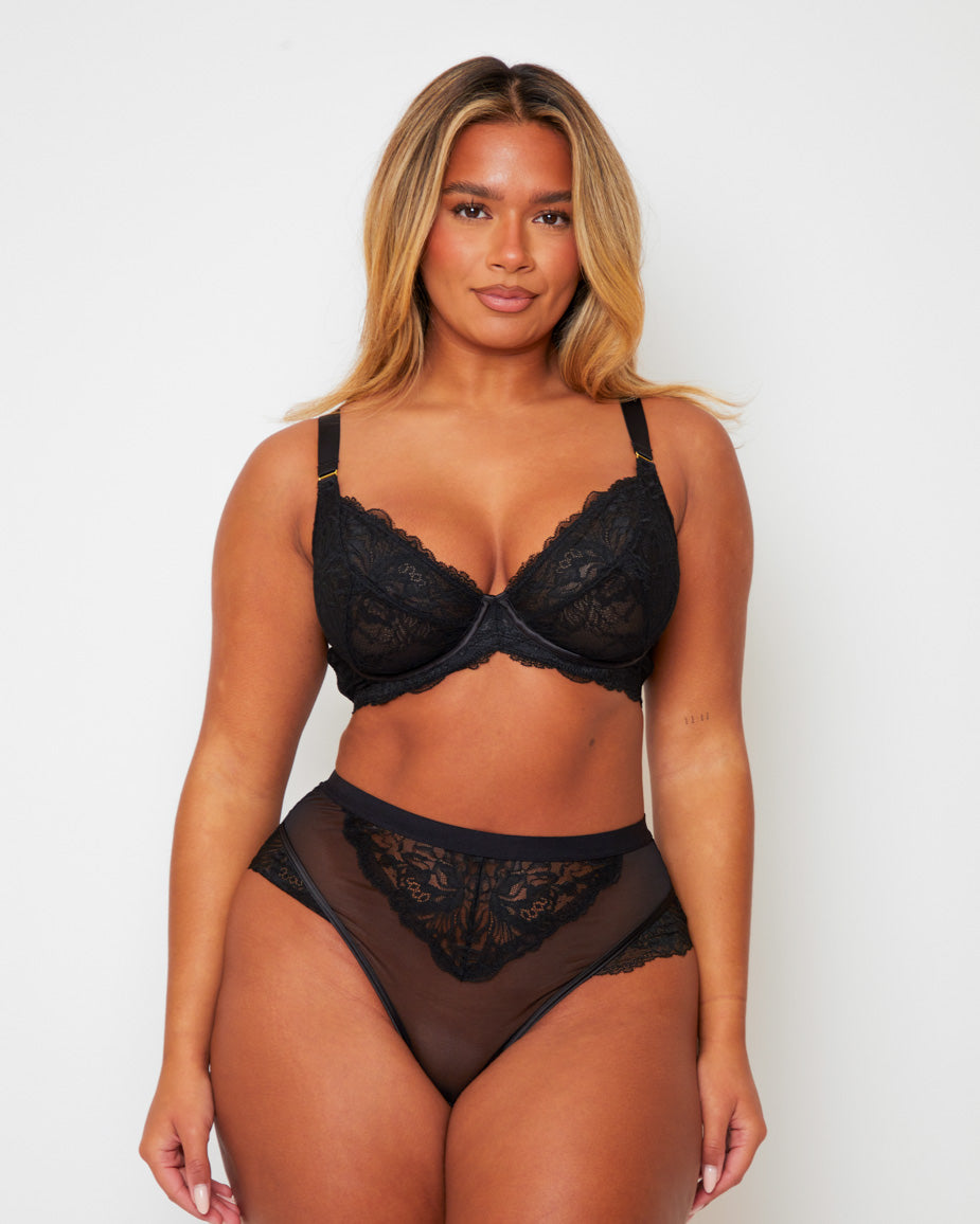 Front view of the Tutti Rouge Harlow Fuller Bust Bra and High Waist Brief Set in Midnight Black featuring supportive underwired lace cups, sheer mesh and elegant floral lace detailing.