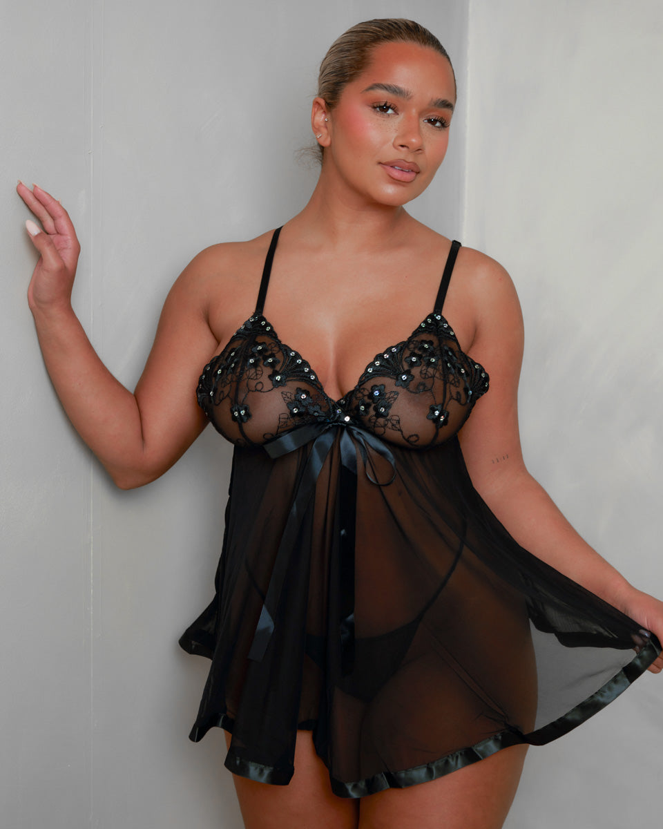 Back view of the Tutti Boudoir Kaia Babydoll in Onyx Black, highlighting the lightweight sheer mesh, adjustable shoulder straps and elegant draped silhouette for a romantic look from every angle.