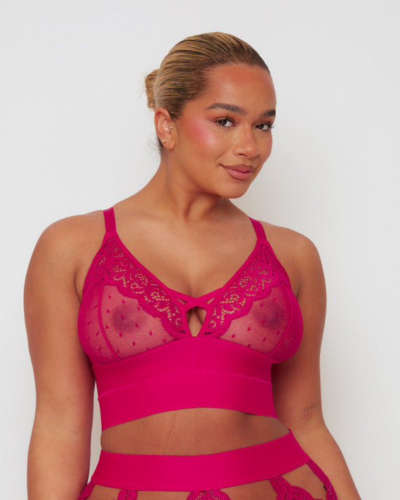Close-up of the Tutti Rouge Victoria Bralette in Very Cherry highlighting sheer dotted mesh, floral lace trim, plunge neckline and supportive longline underband.