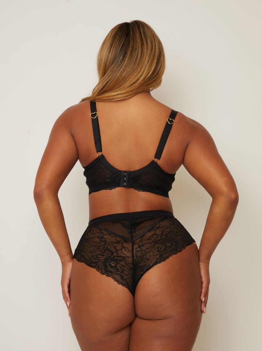 back view of woman wearing a Tutti Rouge lace plunge bra and matching brazilian in midnight black