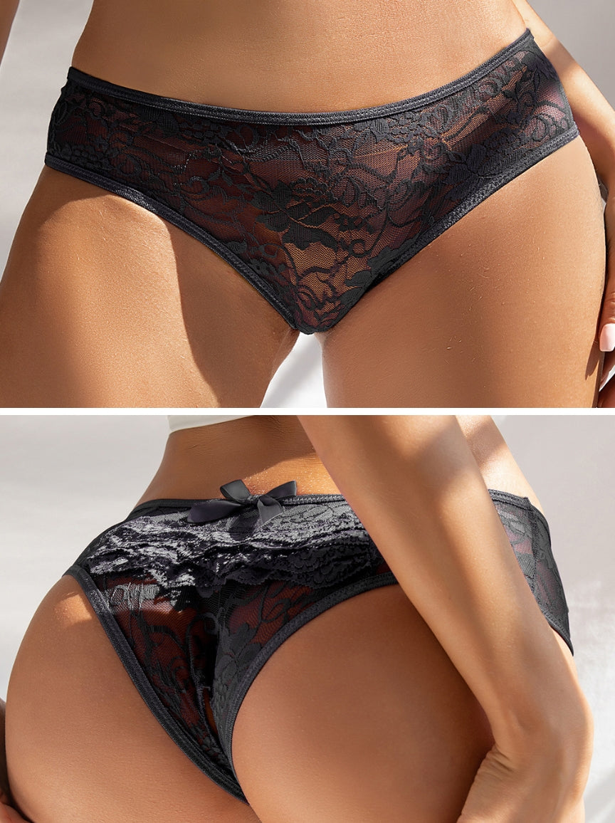 Black lace underwear worn by a model on a neutral background